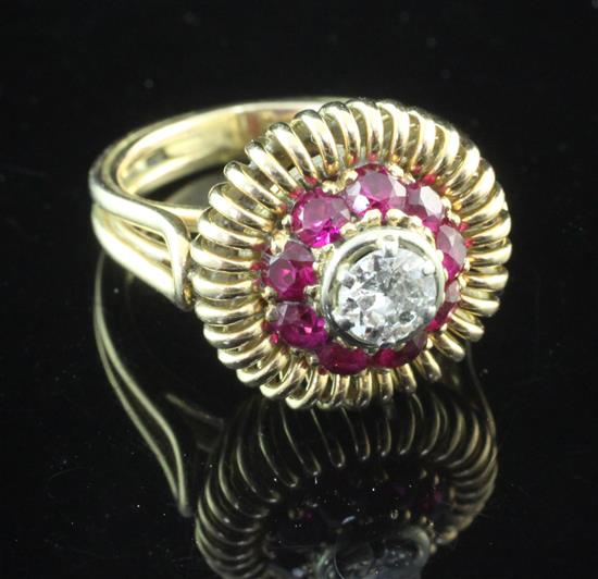 A 1960s? continental gold, diamond and synthetic ruby target dress ring, size P